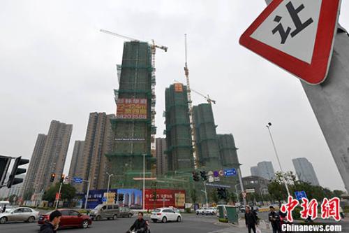 资料图:商品房在建中。 中新社记者 吕明 摄 资料图:商品房在建中。 中新社记者 吕明 摄