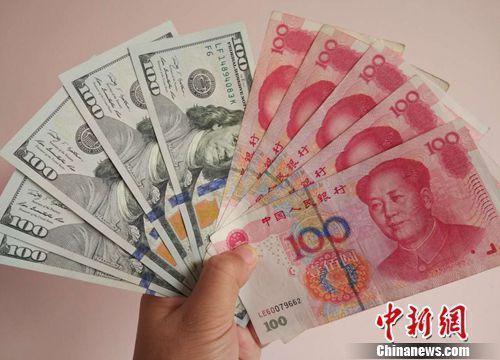 人民币和美元资料图。中新网记者 李金磊 摄 人民币和美元资料图。中新网记者 李金磊 摄